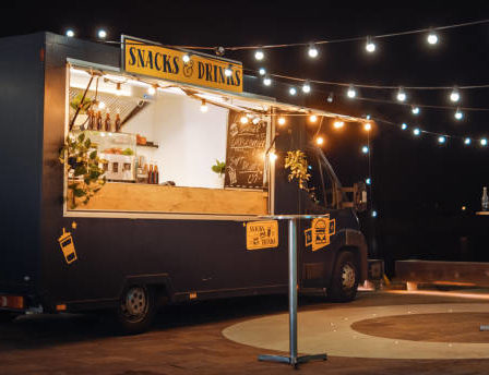 Food truck serving snacks and drinks, mobile kitchen business opportunity.